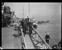 Herbert Hoover with a Navy admiral in full special dress on a dock in San Pedro, Los Angeles, circa 1929-1934