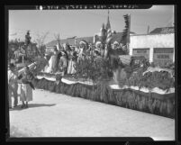 American Indian actors on Screen Actors Guild float in Los Angeles Labor Day parade, 1937