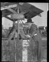 W. Parker Lyon leans over the wishing well at the Pony Express Museum, Arcadia, 1939