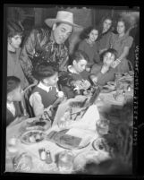 Actor Leo Carrillo hosting Thanksgiving dinner for Mexican American children at La Golondrina restaurant in Los Angeles, Calif., 1937