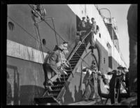 Workers load sheep on the the C. A. Larsen while news reporters film, Los Angeles, 1928