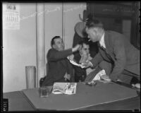 Paul McDonald, Joe Shapiro and Charles Forbes wait in the District Attorney's office, Los Angeles, 1936