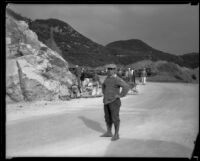 A day laborer pauses to be photographed in Griffith Park during a project to widen the road, Los Angeles, 1933