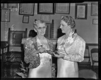 Mae Cushman presents Effie Mabel Fletcher with her new position in the American Gold Star Mothers, Los Angeles, 1939