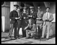 Byrd Antarctic Expedition crew members pose with oranges, Los Angeles, 1928