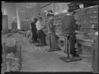 Beverly Hills Post Office, interior with men sorting mail, Beverly Hills, 1934