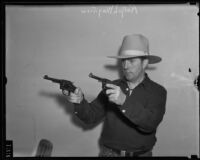 Dr. Ralph Wagner, extortion victim, holding two guns, Santa Clarita, 1935