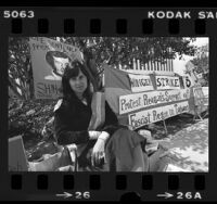 Linda Arrigo, wife of Taiwanese political prisoner Shih-Ming-Deh, seated outside Ronald Reagan's headquarters in Los Angeles, Calif., 1980