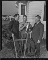 Dr. Earl A. Hershman and R. R. Granger present Joseph Van Dyke with his trophy, Artesia, 1935