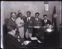 Joseph Ford, Leonard Wilson and David H. Clark in courtroom at Clark's arraignment, Los Angeles, 1931