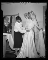 Hollywood fashion designer Edith Head working on a wedding gown for Dick Tracy comic strip's Gravel Gertie, 1946