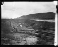 Railroad track twisted by the flood following the failure of the Saint Francis Dam, Santa Clara River Valley (Calif.), 1928