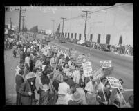 Film strike pickets on street near entrance to Warner Bros. Studio, 1945