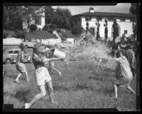 UCLA students having water fight, 1942