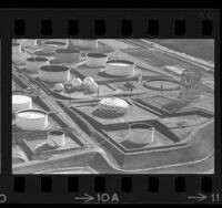 Aerial view of tanks, one painted as a jack-o-lantern, at Union Oil Co. refinery in Wilmington, Calif., 1965