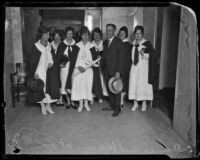 Aimee Semple McPherson and her lawyer, Arthur Veitch, pose with her followers at the Hall of Justice, Los Angeles, 1926