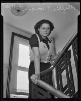 Phyllis Troncale, 16-year-old accident victim, stands at a banister, Los Angeles, 1935