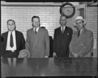 Joe Wagner, Irving Fenton, H. Newkirk Wheeler, and Joe Roller escorted by Marshal Paul Hendricks, Los Angeles, 1935