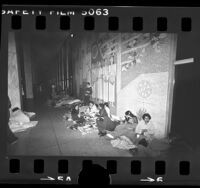 Mexican nationals outside Federal Building waiting for opening of immigration office in Los Angeles, Calif., 1977