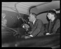 President Franklin Roosevelt speaks to a crowd from the back of a car, [Los Angeles], 1935