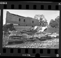 Earthquake damage automobiles and collapsed building at 100 block of S. Fair Oaks in Pasadena, Calif., 1987
