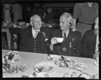 Civil War veterans Eugene Merrick and F. H. Crafts enjoy Christmas dinner at Patriotic Hall, Los Angeles, 1938