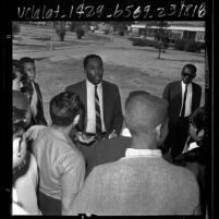 Baseball player Johnny Roseboro speaking with students at Ralph J. Bunche Junior High School in Los Angeles, Calif., 1966