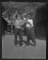 Andrew McKenna and Sam Abed sword fight for movie, Los Angeles, 1935