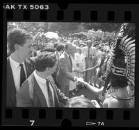 Spain's King Juan Carlos I and Queen Sofia meeting Aztec dancers in Los Angeles, Calif., 1987