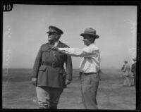 Colonel Harcourt Hervey and Eugene Biscailuz on golf course, Los Angeles