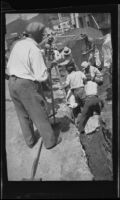 Workers attempt to rescue John M. Burns, Robert Rosenthal, and Bernard Glennin after a cave-in, Los Angeles, 1937