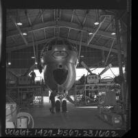 Air National Guard maintenance crews working on Stratofreighter in hanger at Van Nuys Airport, Calif., 1966