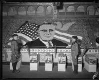 Two uniformed boys salute each other in front of a display at the Los Angeles County Fair, Pomona, 1933