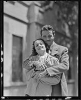 Newlyweds, Onslow Stevens and Phyllis Cooper embrace for publicity shot, Los Angeles, 1934
