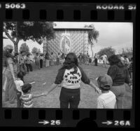 Victory Outreach members holding outdoor prayer service in East Los Angeles, 1981