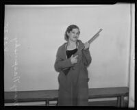 Mary Naspinsky posed with an air rifle, Los Angeles, 1935