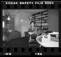 Writer and director Desmond Nakano seated in his apartment in Los Angeles, Calif., 1980