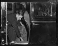 Ted Allen finds a secret compartment in an automobile used by Joe Shaw, Los Angeles, 1938