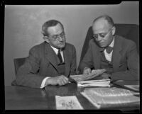 Mr. Justice Macrossan and Judge Leon Yankwich looking over papers, Los Angeles, circa 1938