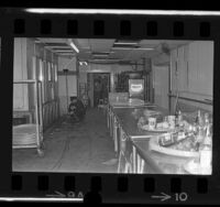 Los Angeles police officer inspecting area of Ambassador Hotel kitchen where Robert F. Kennedy was shot, 1968