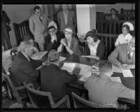 Gladys Carter negotiates custody of her daughter with her lawyers Anna Zacseck and Ed Haumsech, Los Angeles, 1935