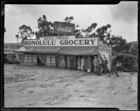 Auto Electrical and Honolulu Grocery damaged by the October flood and mudslide, La Crescenta-Montrose, 1934