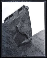 View from below, looking up at remains of St. Francis Dam after its disastrous collapse, Francisquito Canyon (Calif.), 1928