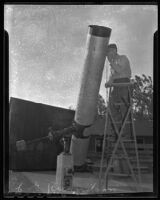 E. G. Richardson beside the telescope that he constructed for Whittier College, Whittier, 1947