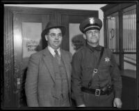 E. S. Strong and R. E. Foell pose for a photograph at the police station, El Monte, 1936
