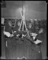 Four youths engaged in Kendo at the 2nd annual Nisei Festival (Nisei Week), Los Angeles, 1935