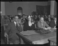 Photograph of Myrtle St. Pierre seated with Lorrin Andrews and another attorney at the County Courthouse, Los Angeles, 1932