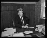 Portrait of Dr. Philip Fox seated at his desk, Los Angeles, 1935