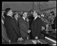 Los Angeles Country Supervisor Roger Jessup shaking hands in a crowd, Los Angeles, 1932-1939