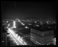 Nighttime cityscape seen from city hall tower looking northwest, during dim-out in Los Angeles, Calif., 1943